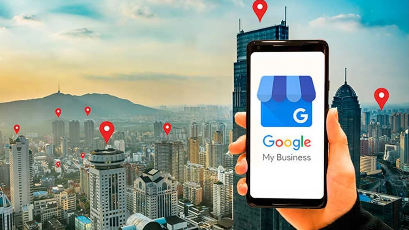 Mobile phone displaying Google My Business over city map with location pins as part of a Google My Business optimization strategy